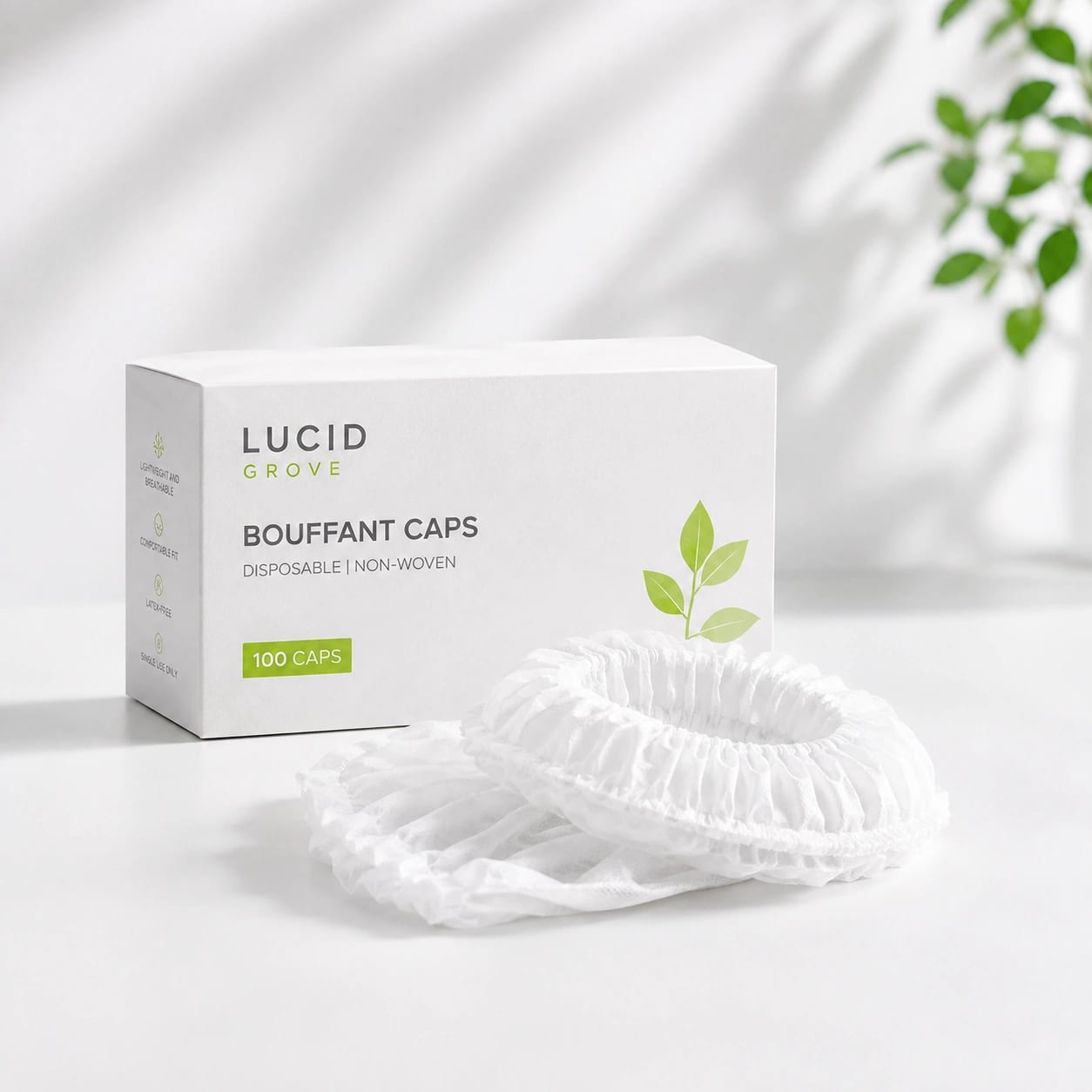 A Lucid Grove box of disposable bouffant caps with a cap laid out beside it.