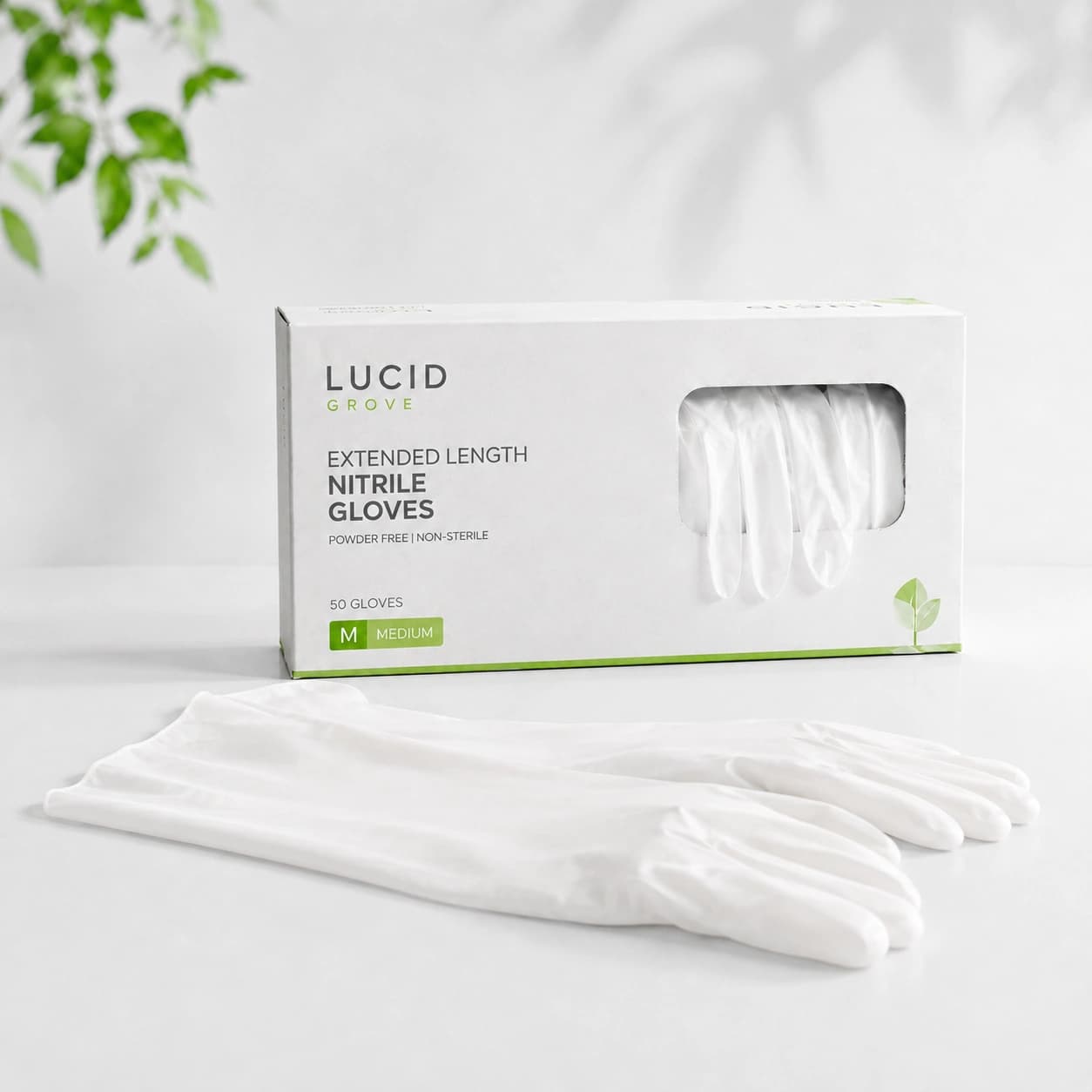 A Lucid Grove box of extended-length nitrile gloves with a long-cuffed pair laid out beside it.