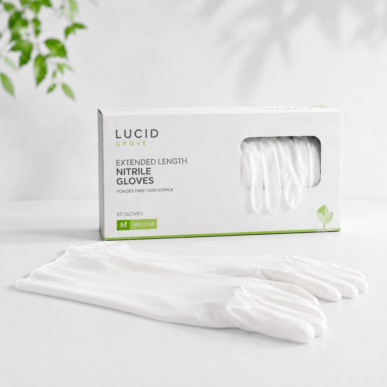 A Lucid Grove box of extended-length nitrile gloves with a long-cuffed pair laid out beside it.